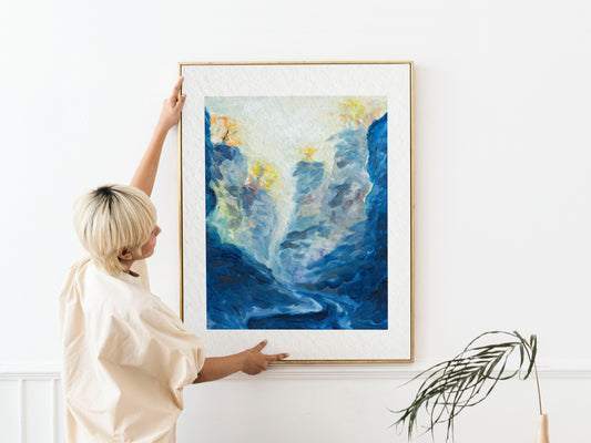Framed Blue Passage fine art print by Bogdan Jensen shown at human scale, featuring deep blue forms, pale light, and yellow marks