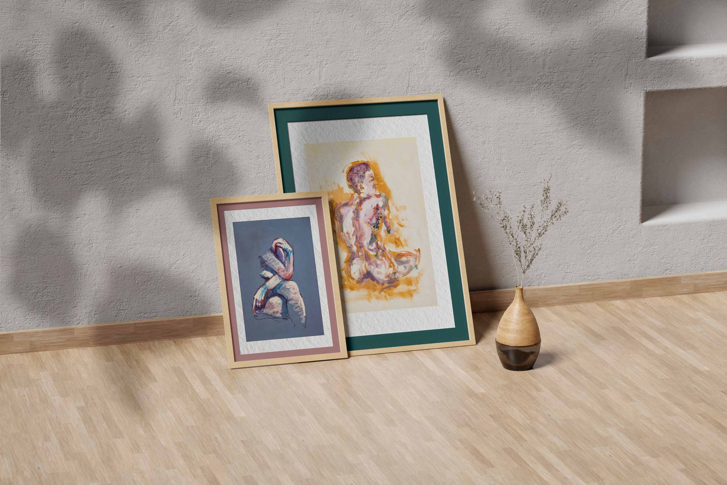 Felt through Gold fine art print by Bogdan Jensen shown leaning in a floor frame, with the seated figure painting beside a smaller framed artwork