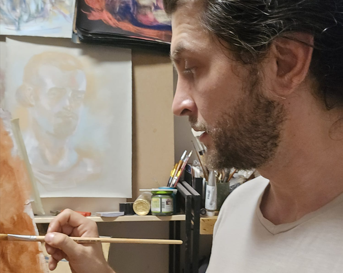 صورة للفنان Bogdan Jensen أثناء رسمه على قماش. 