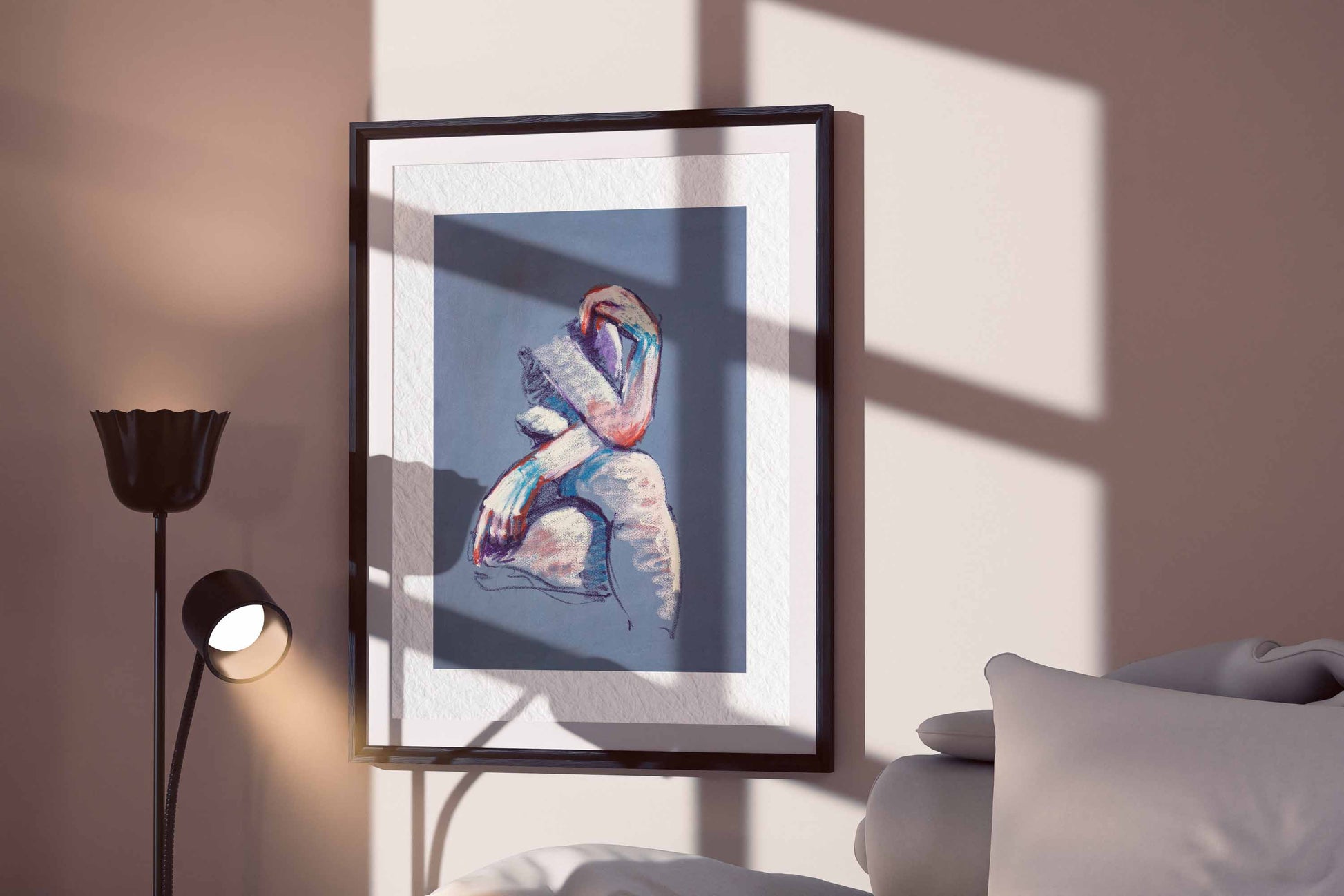 A Gentle Touch fine art print by Bogdan Jensen displayed in a framed bedroom mockup with soft window shadows and a seated pastel figure study