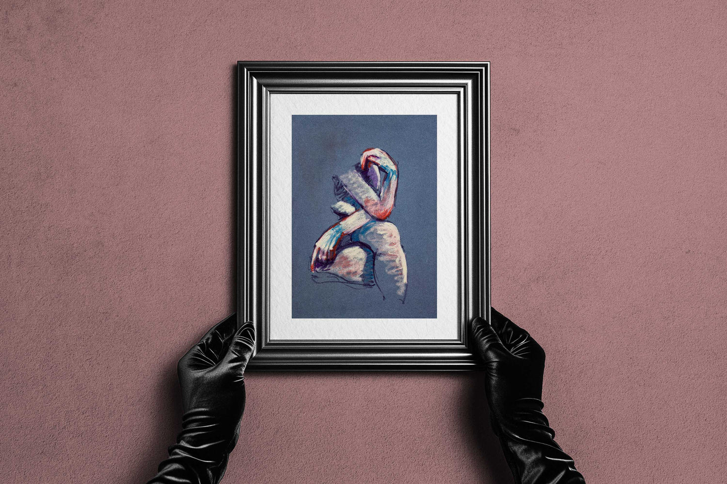Framed A Gentle Touch fine art print by Bogdan Jensen held by hands, showing the soft pastel seated figure in a dark frame
