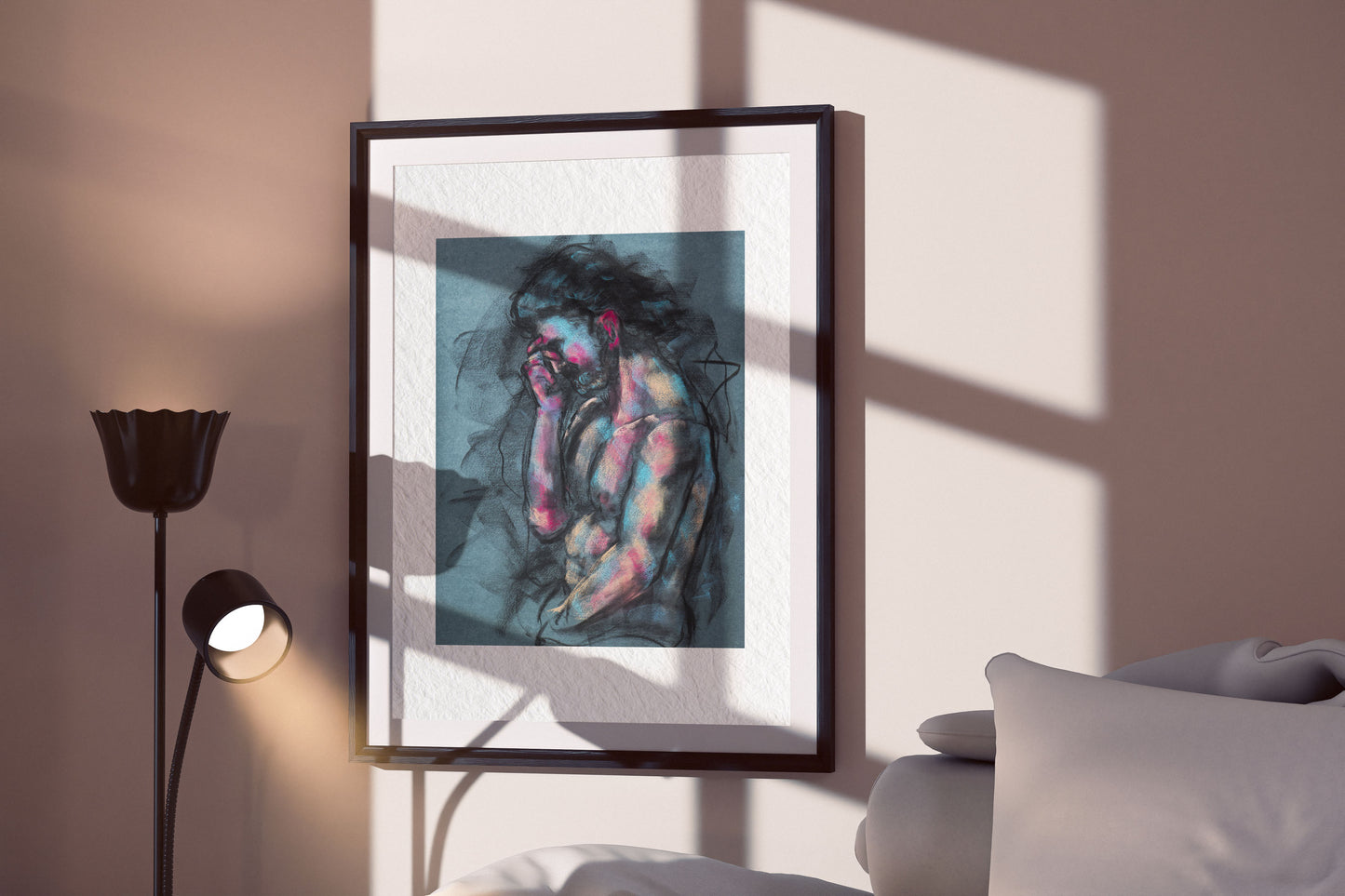 A Quiet Ache fine art print by Bogdan Jensen displayed in a framed bedroom mockup with soft window shadows and a seated figure drawing in charcoal, blue, and rose tones