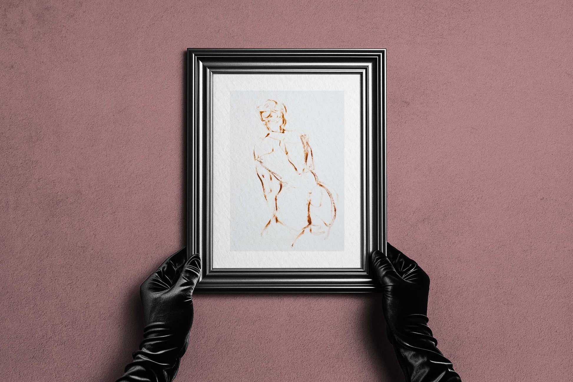 Framed A Shape I Almost Knew fine art print by Bogdan Jensen held by hands, showing the minimal figure drawing in a dark frame