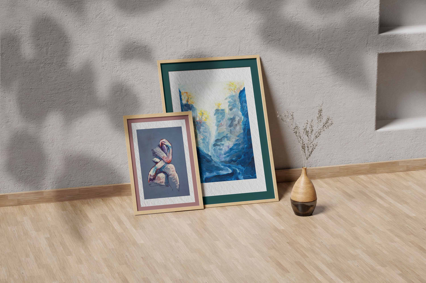 Blue Passage fine art print by Bogdan Jensen shown leaning in a floor frame, with the blue-toned painting beside a smaller framed artwork
