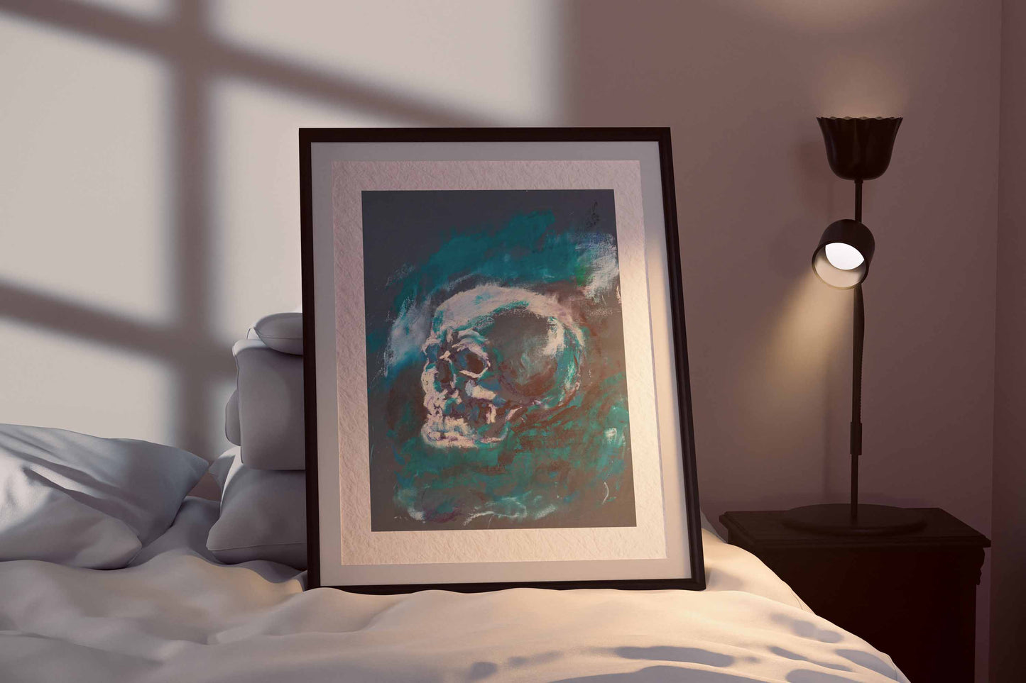 Blue Remains fine art print by Bogdan Jensen shown framed beside a bed, with the skull held in deep teal and blue shadow