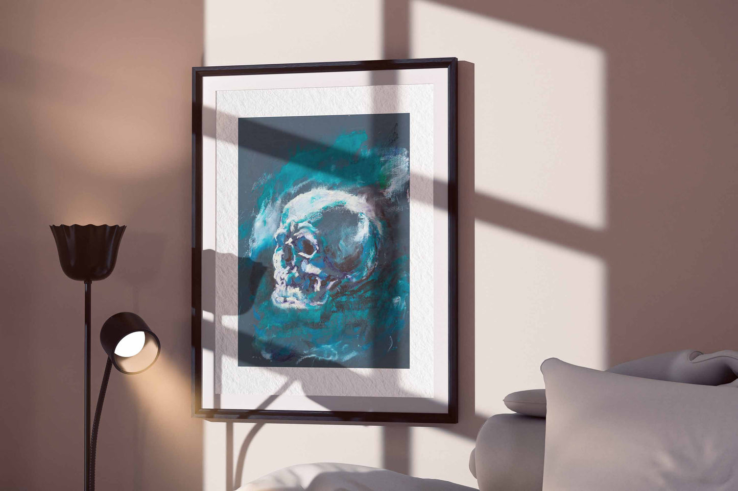Blue Remains fine art print by Bogdan Jensen displayed in a framed bedroom mockup with soft window shadows and a blue skull study