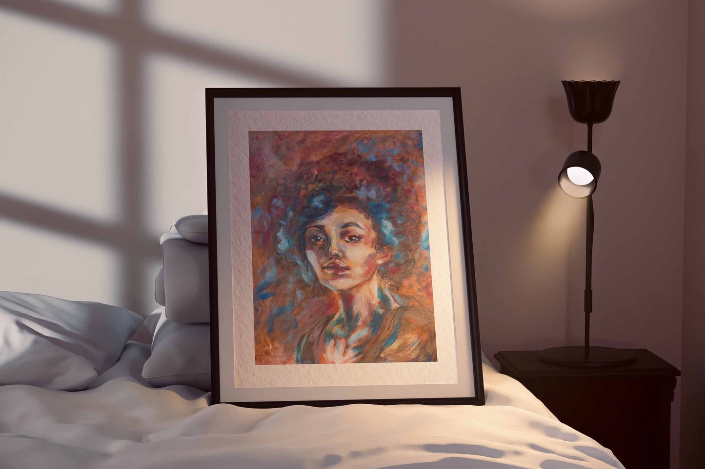 Blue Tempest fine art print by Bogdan Jensen shown framed beside a bed, with the expressive pastel portrait softly lit in blue and warm tones