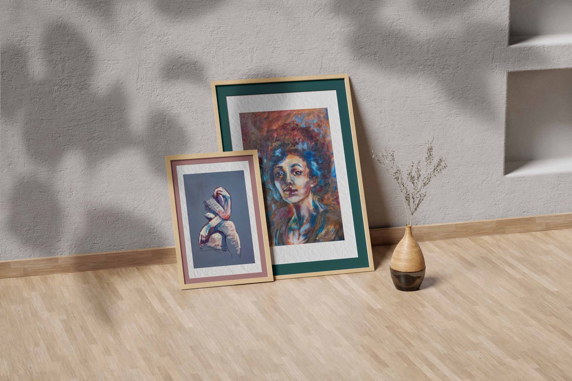 Blue Tempest fine art print by Bogdan Jensen shown leaning in a floor frame, with the colourful pastel portrait beside a smaller framed artwork