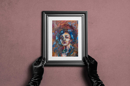 Framed Blue Tempest fine art print by Bogdan Jensen held by hands, showing the colourful soft pastel portrait in a dark frame