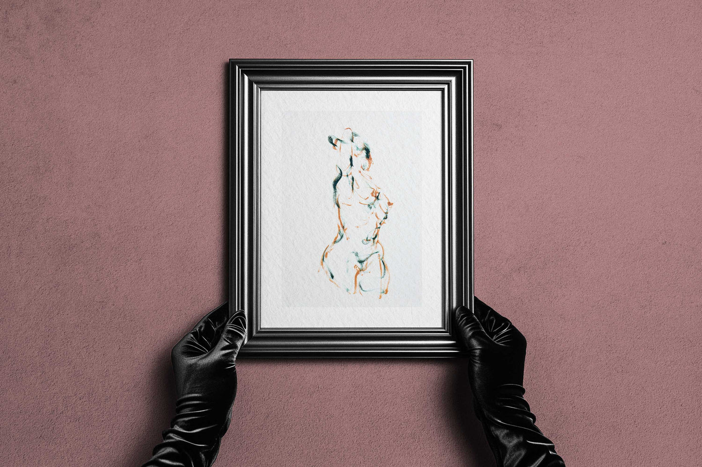 Framed Dancing into Form fine art print by Bogdan Jensen held by hands, showing the expressive figure drawing in a dark frame