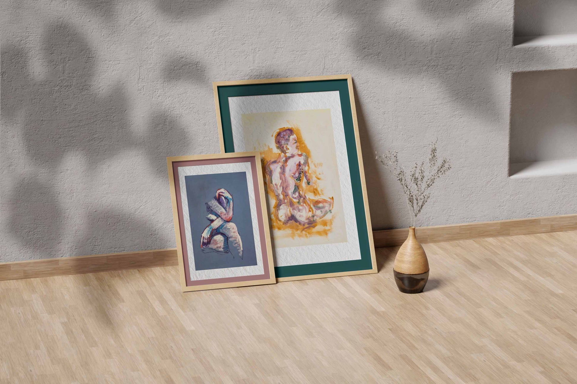 Felt through Gold fine art print by Bogdan Jensen shown leaning in a floor frame, with the seated figure painting beside a smaller framed artwork
