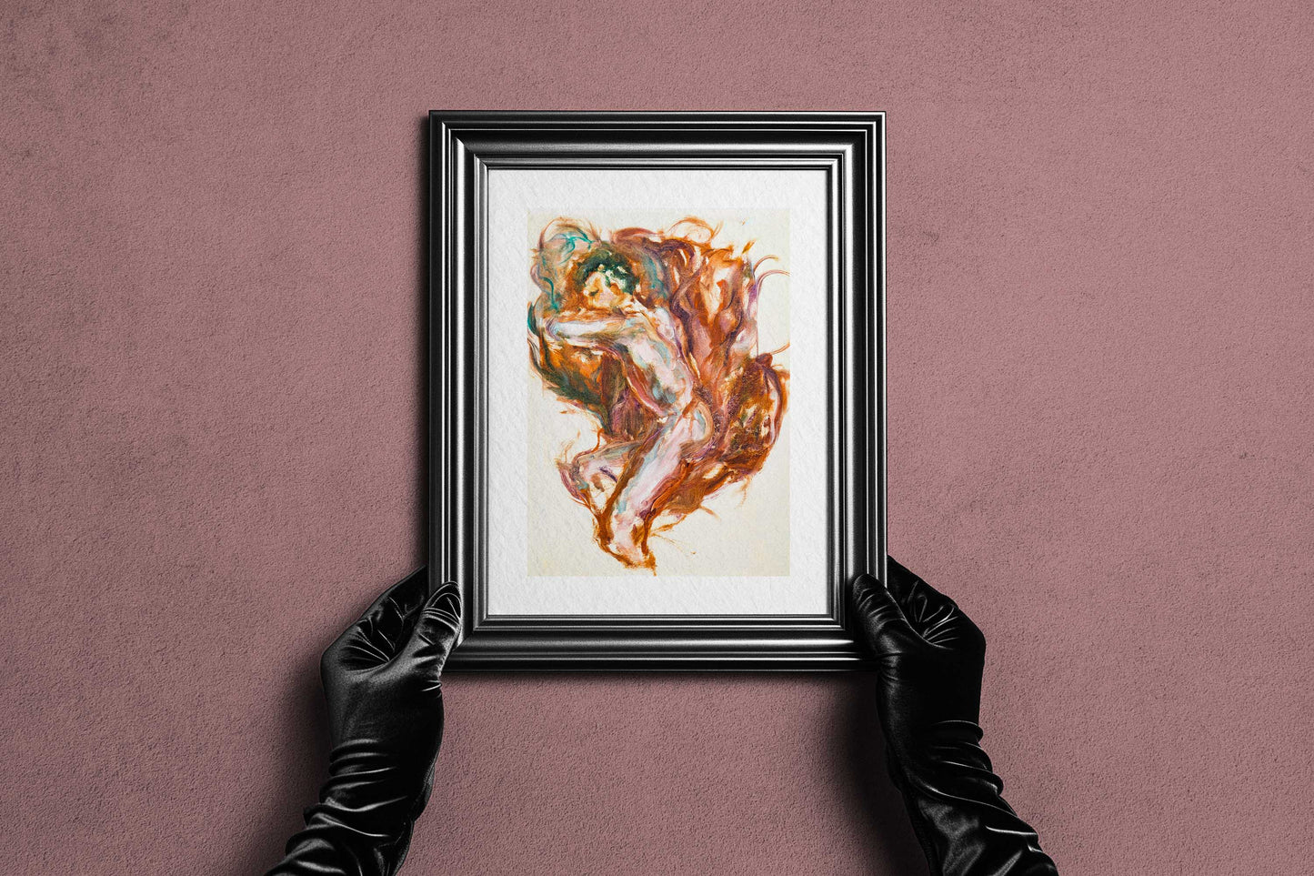 Framed Held by Fire fine art print by Bogdan Jensen held by hands, showing the reclining figure painting in a dark frame
