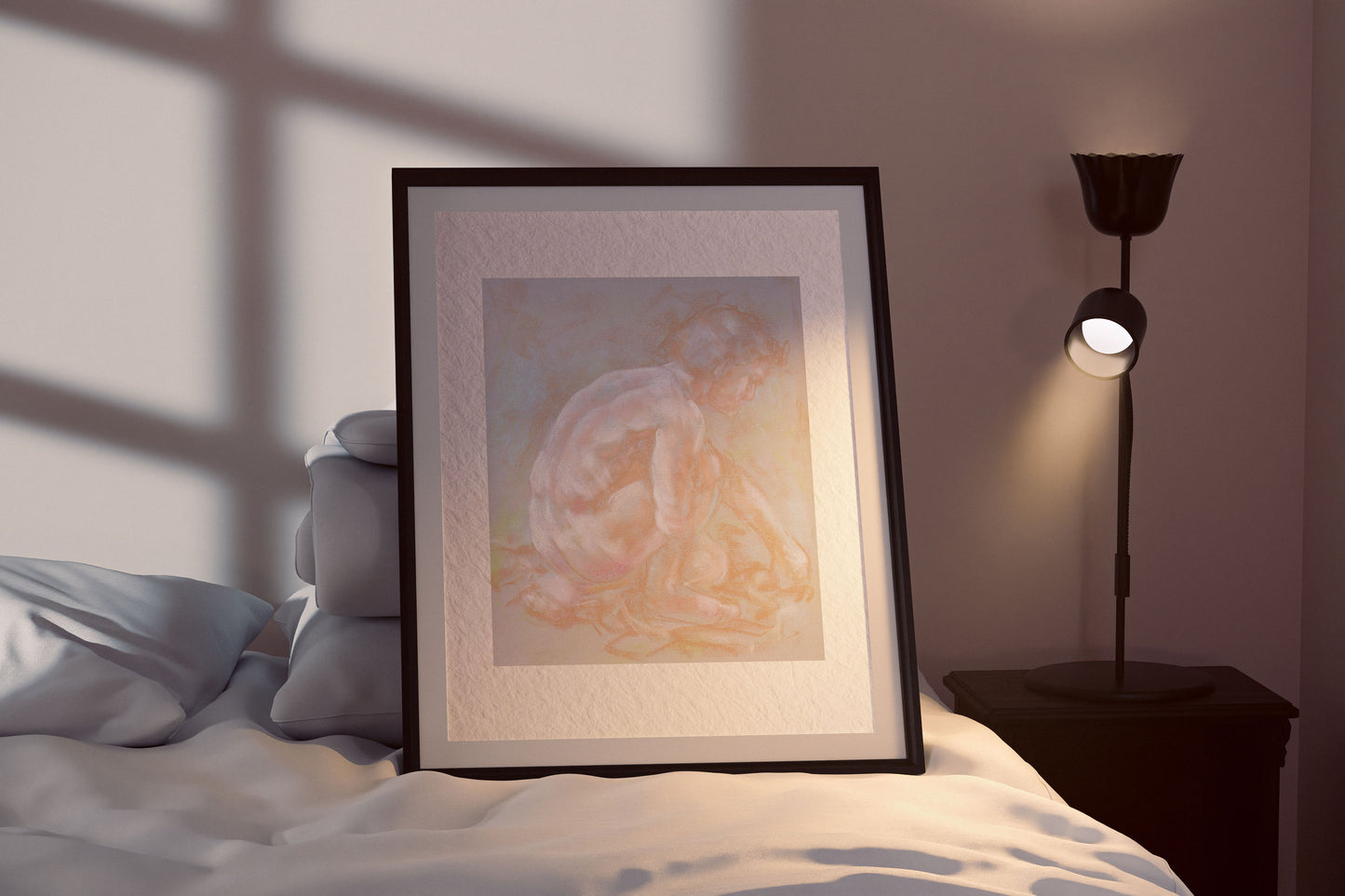 Inner Stillness fine art print by Bogdan Jensen shown framed beside a bed, with the crouched figure softly lit in pale pastel tones
