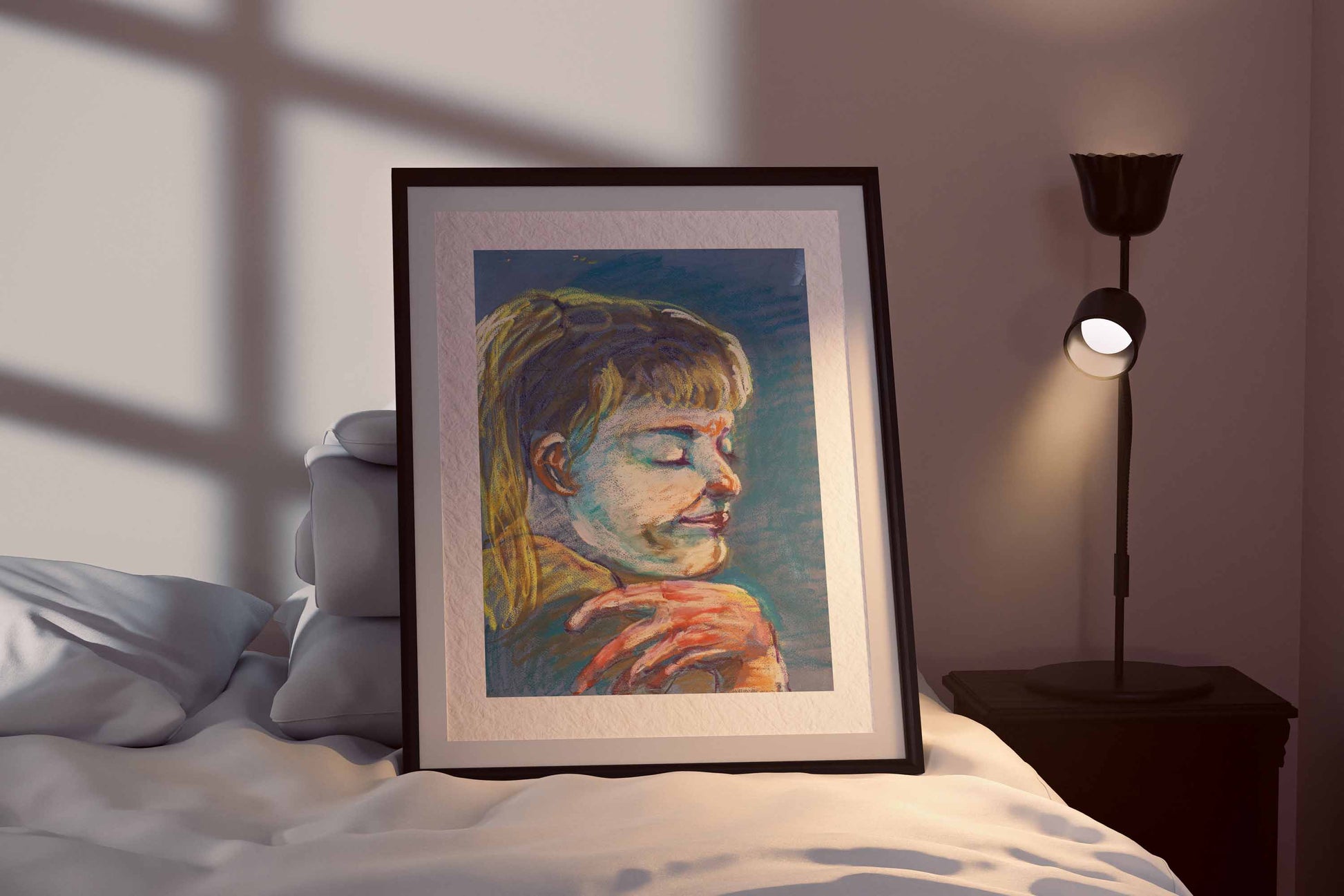 Quiet Tide fine art print by Bogdan Jensen shown framed beside a bed, with the portrait softly lit in cool blue and warm pastel tones