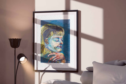Quiet Tide fine art print by Bogdan Jensen displayed in a framed bedroom mockup with soft window shadows and a reflective pastel portrait