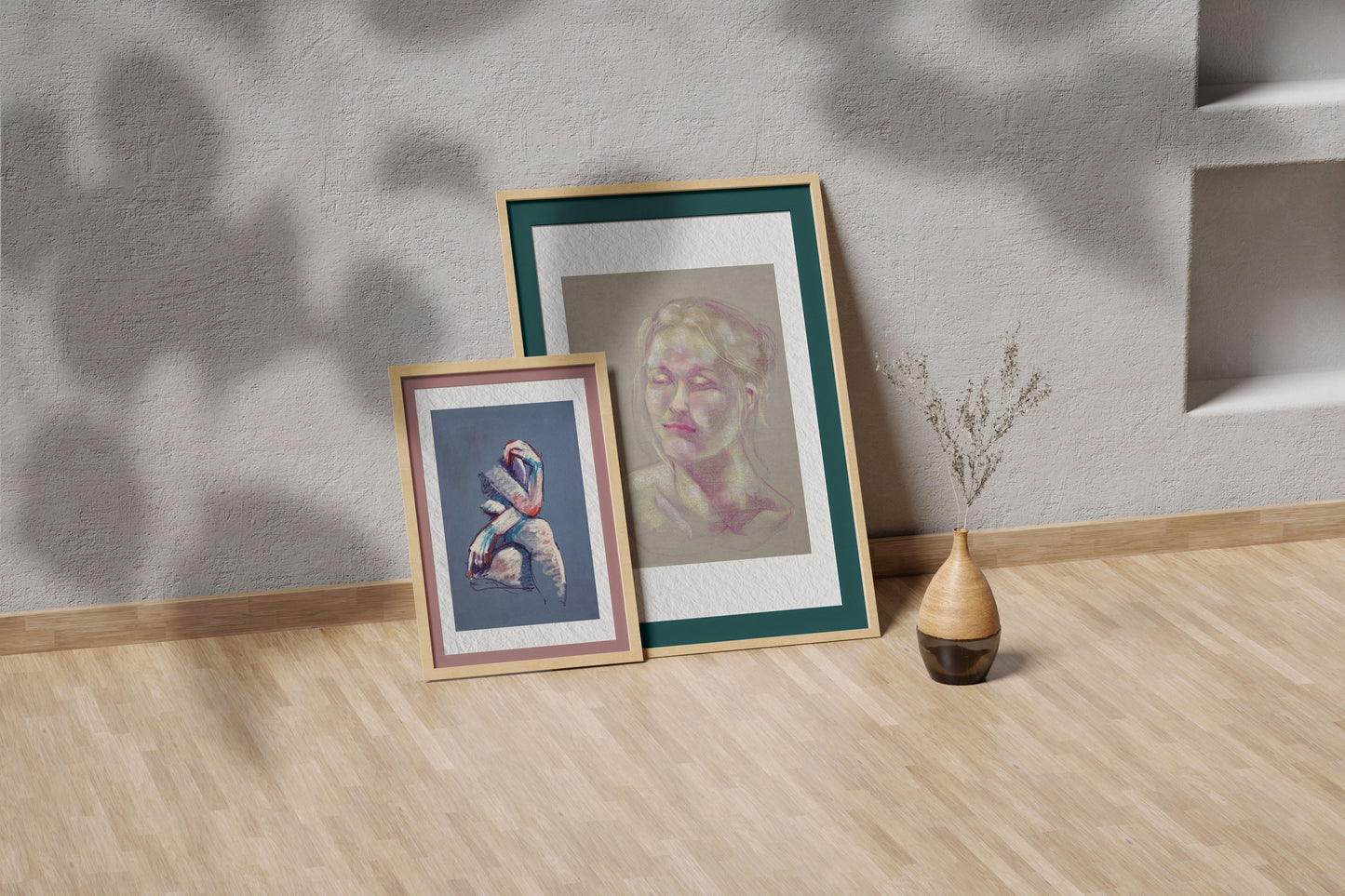 Soft Glow fine art print by Bogdan Jensen shown leaning in a floor frame, with the soft pastel portrait beside a smaller framed artwork