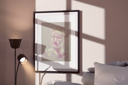 Soft Glow fine art print by Bogdan Jensen displayed in a framed bedroom mockup with soft window shadows and a pastel portrait in gentle light tones