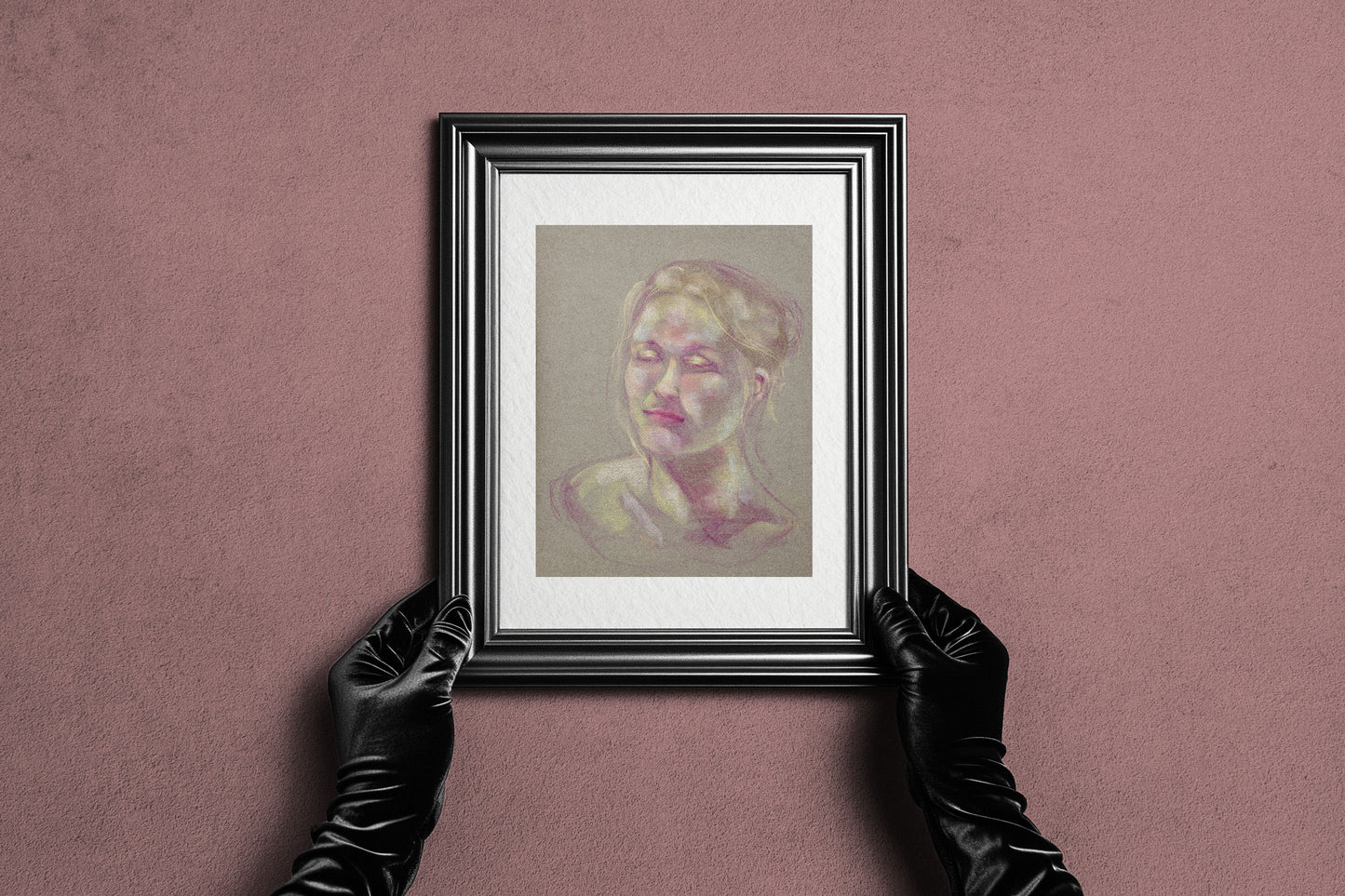 Framed Soft Glow fine art print by Bogdan Jensen held by hands, showing the soft pastel portrait in a dark frame