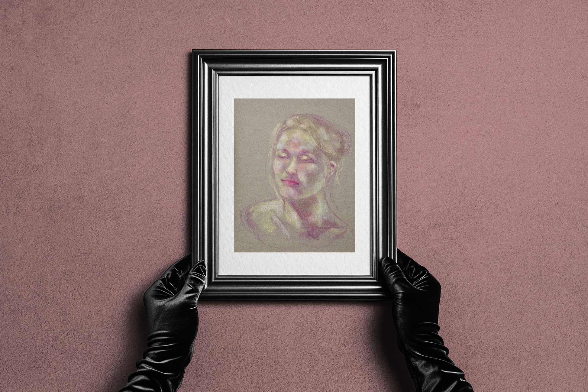 Framed Soft Glow fine art print by Bogdan Jensen held by hands, showing the soft pastel portrait in a dark frame