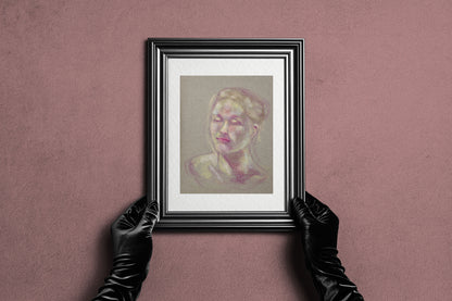 Framed Soft Glow fine art print by Bogdan Jensen held by hands, showing the soft pastel portrait in a dark frame