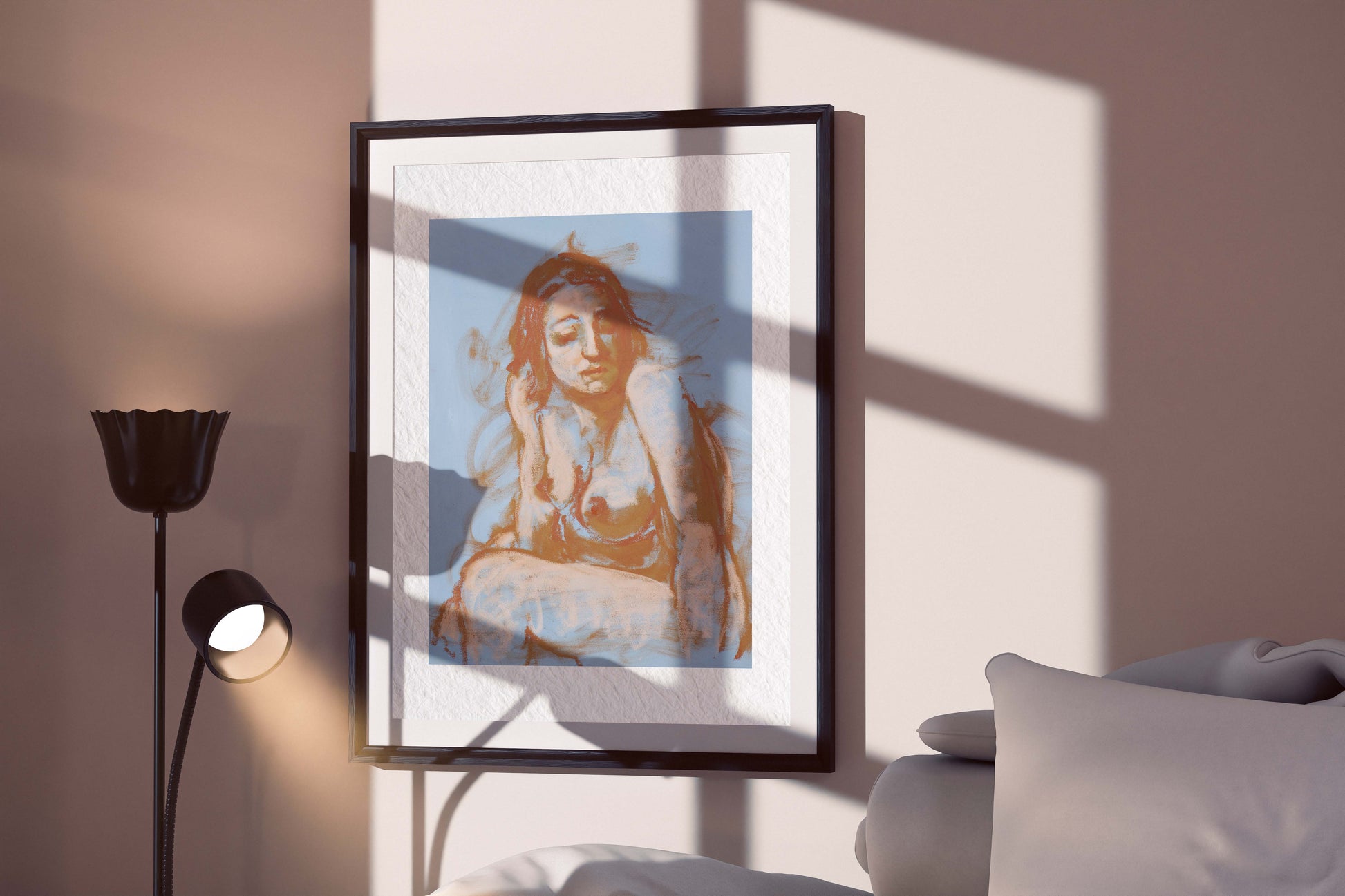 Soft Whisper pastel figure study fine art print in a black frame, displayed on a softly lit wall with window shadows and a modern interior.