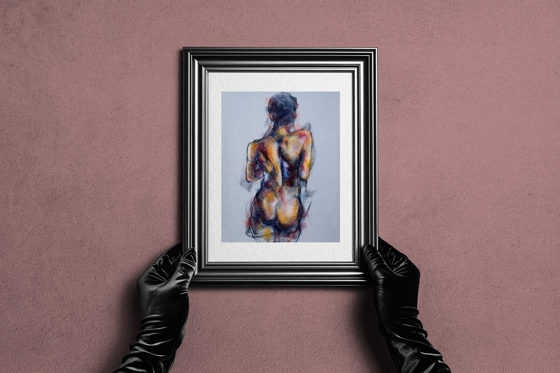 Framed Where the Dance Lives fine art print by Bogdan Jensen held by hands, showing the pastel figure study in a dark frame