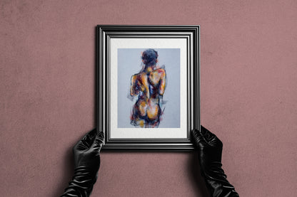 Framed Where the Dance Lives fine art print by Bogdan Jensen held by hands, showing the pastel figure study in a dark frame